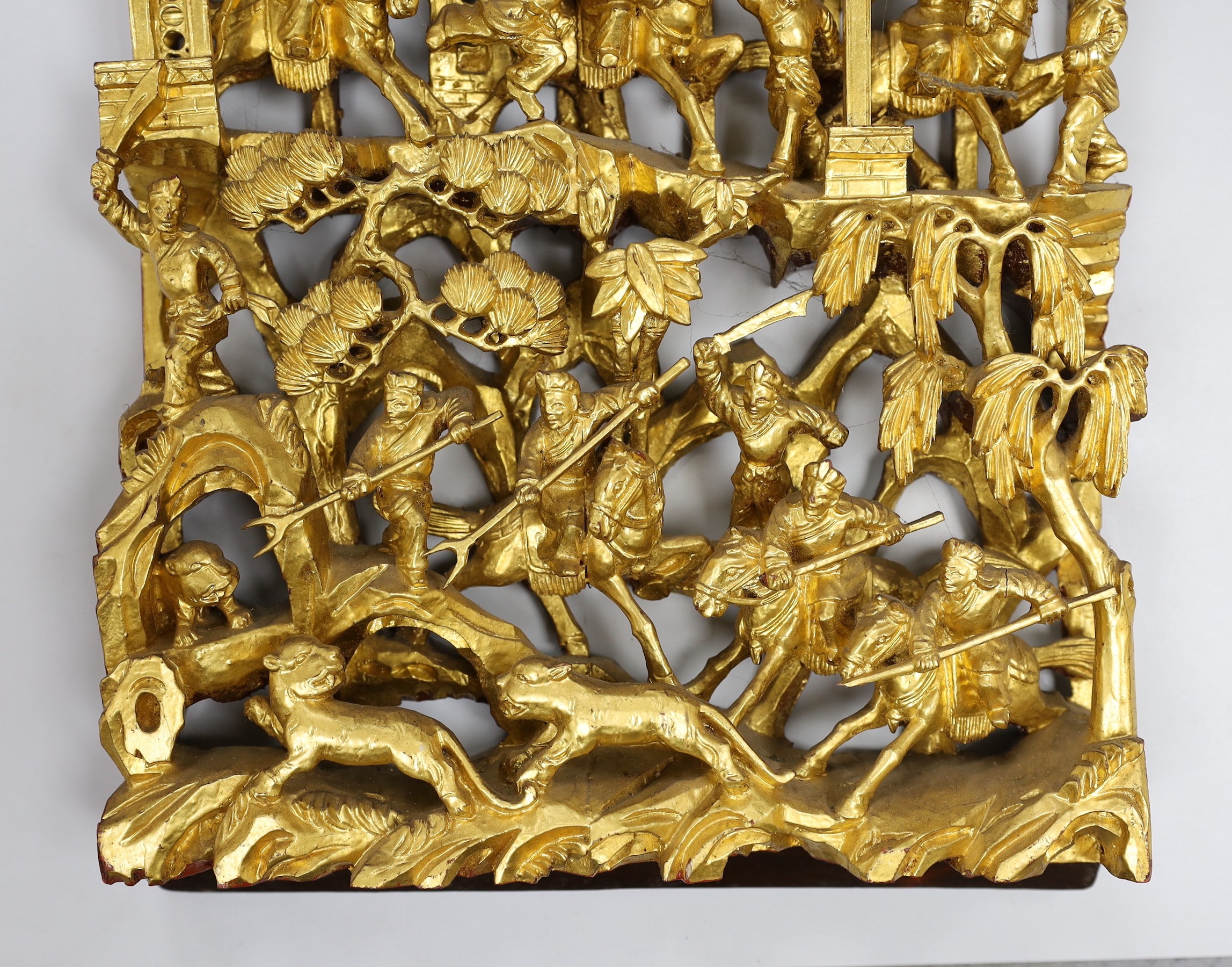 A Chinese gilt carved figural relief, 25cms wide, 54cms high